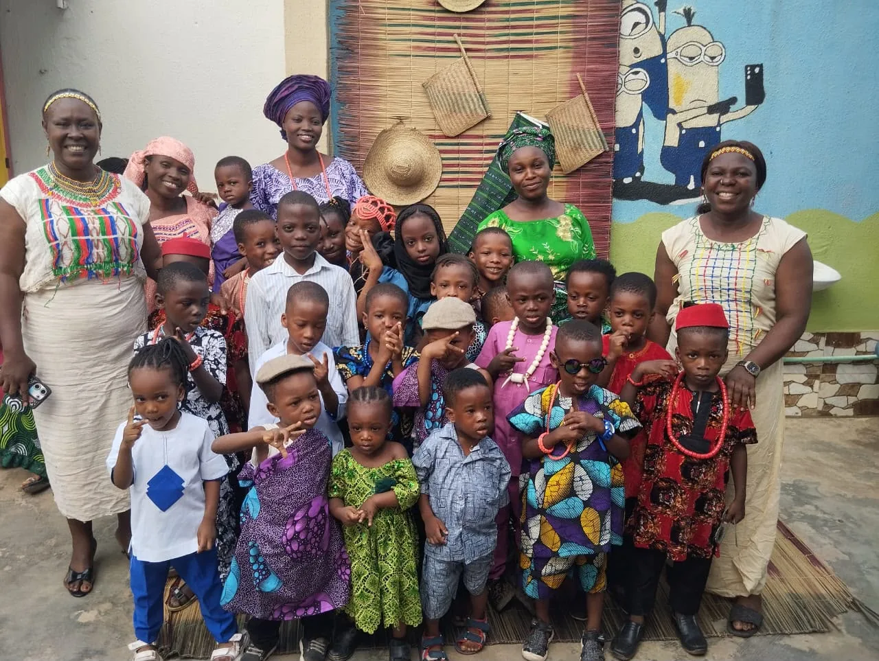 Pupils and staff gathered in traditional dress for a whole-school cultural day photograph